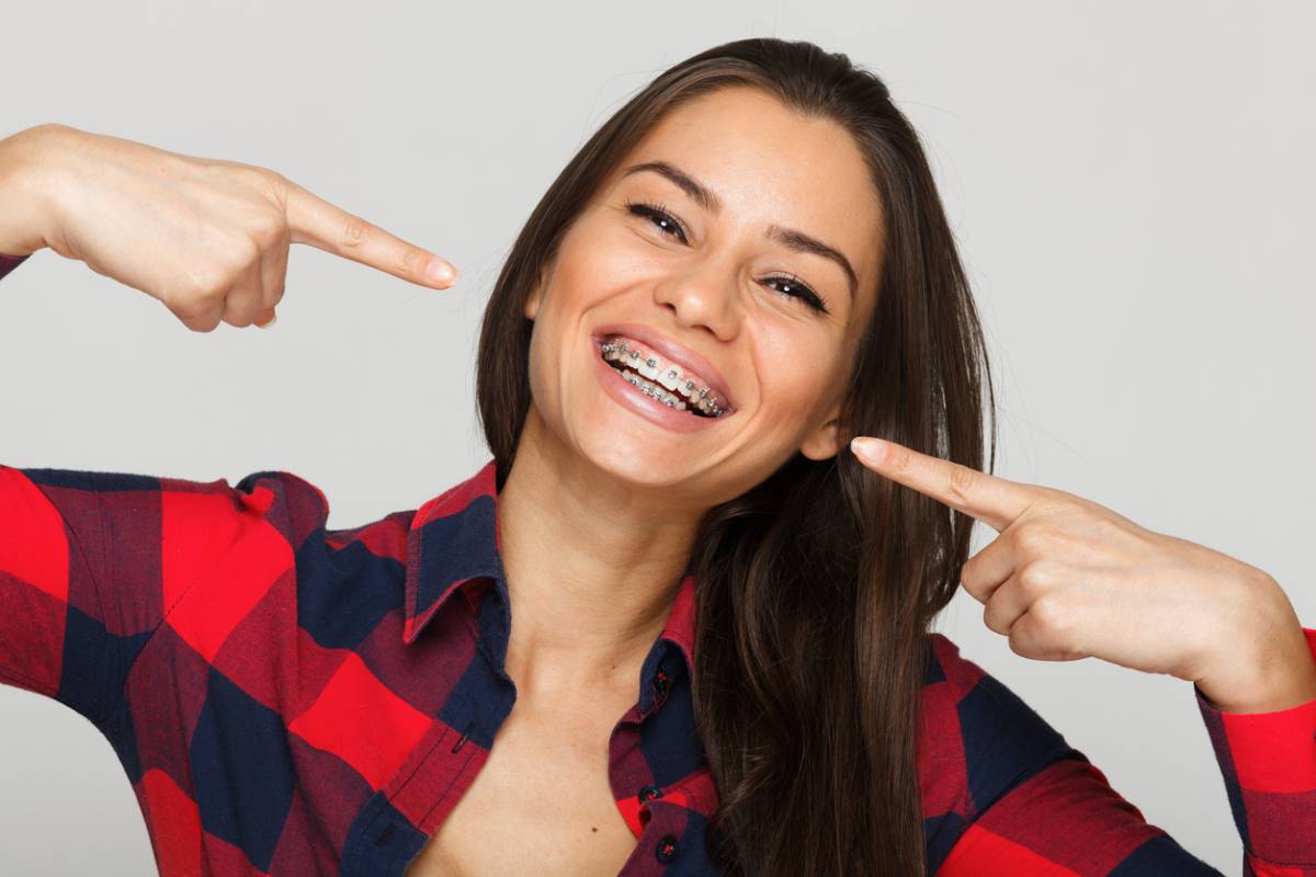 woman smiling with braces in her mouth