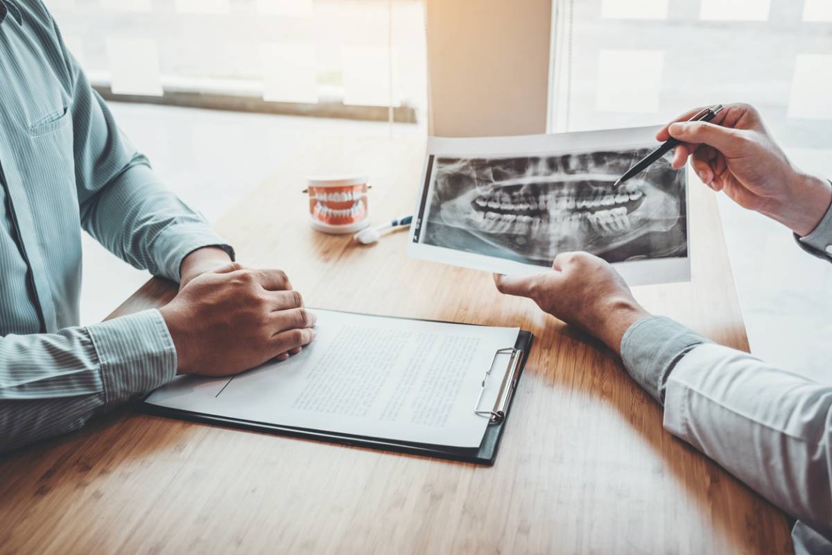 Patient talking with dentist to prepare for braces